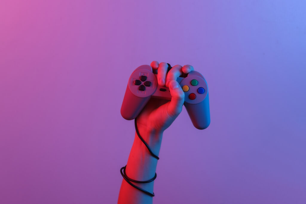 hands-holding-retro-joystick-blue-red-neon-gradient-light-old-gaming-80s-retro-wave-minimalism (2)
