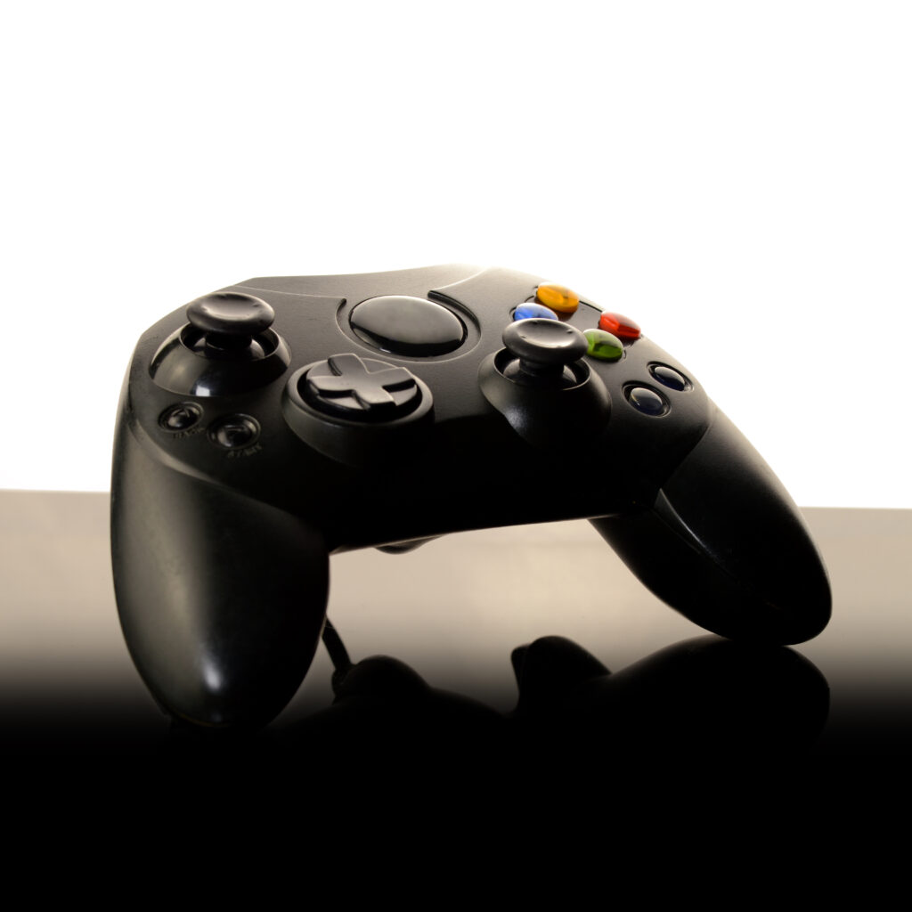 video-game-controller-on-reflective-black-surface-2026-03-26-11-42-54-utc